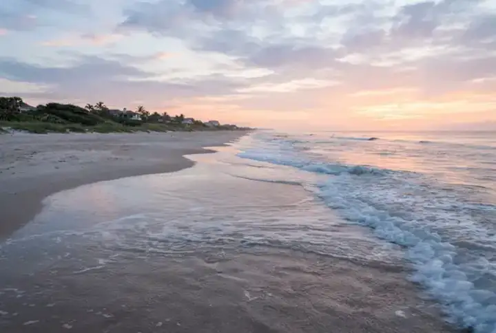 Ponte Vedra Beach FL Atlantic Ocean shoreline at sunset with waves rolling onto the sand — website design Ponte Vedra Beach FL, Jacksonville area